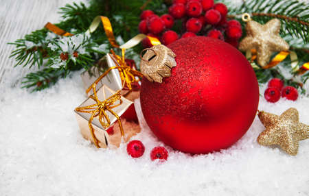 christmas fir tree with decoration in the snowの写真素材