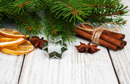 baking concept  - spices for christmas cookie and green pine treeの写真素材