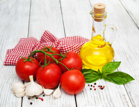 healthy eating with organic tomatoes olive oil and garlicの写真素材