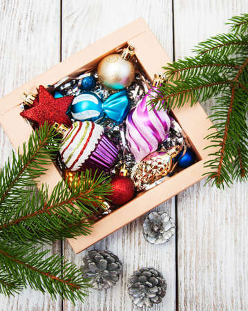 christmas baubles  in the box with green pine treeの写真素材
