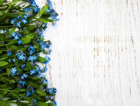 Forget-me-nots flowers  on a wooden backgroundの写真素材