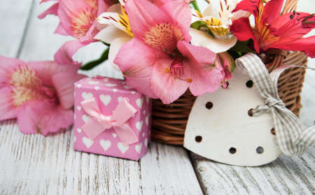 beautiful bouquet of pink alstroemeria with gift boxの写真素材