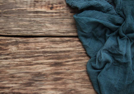 Napkin on a old wooden background - top viewの写真素材