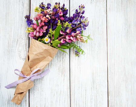 Lupine flowers on a old wooden tableの写真素材