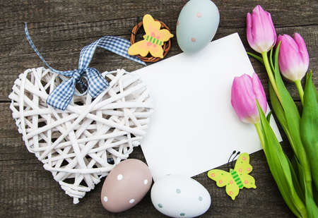 Easter greeting card on a old wooden backgroundの写真素材