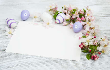 Easter eggs, spring apple blossom and greeting cardの写真素材