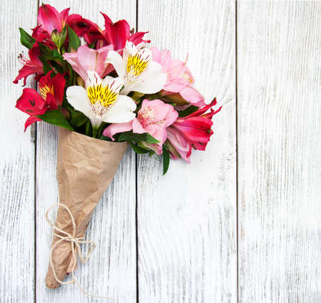 alstroemeria flowers on a old white wooden backgroundの写真素材