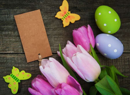 Easter greeting card on a old wooden backgroundの写真素材