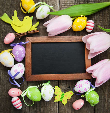 Easter greeting card on a old wooden backgroundの写真素材