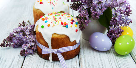 Easter bread and eggs with lilac flowers
