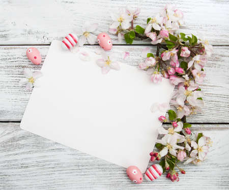 Easter eggs, spring apple blossom and greeting cardの写真素材