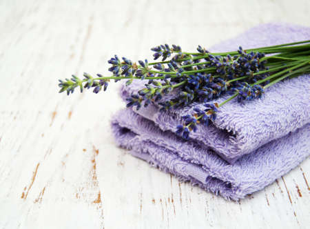 Lavender and massage towels on a old wooden backgroundの写真素材