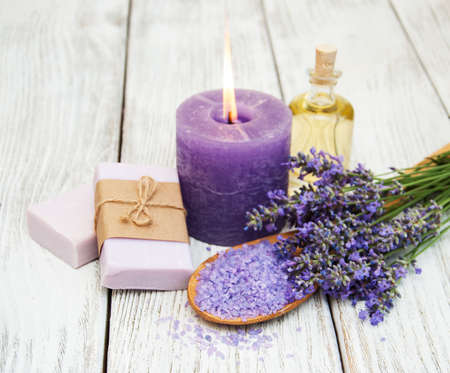 Spa products and lavender flowers on a old wooden backgroundの写真素材