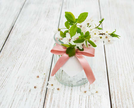 Spring cherries blossom on a old wooden table