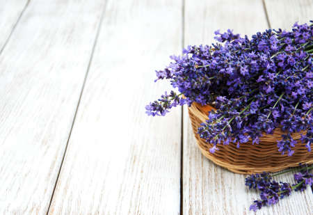 Basket with lavanda flowers on a old woode tableの写真素材