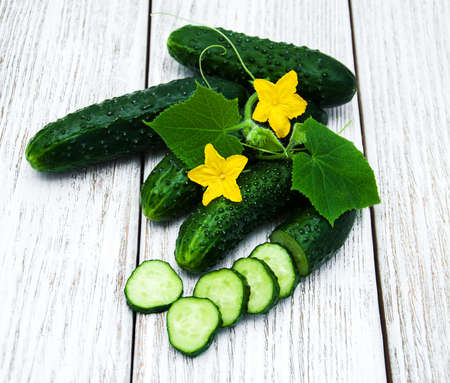 Fresh cucumbers on a old wooden backgroundの写真素材