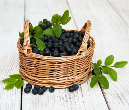 Basket with Blueberries on a old wooden backgroundの写真素材