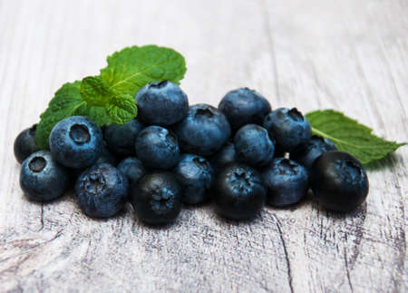 Fresh blueberries on a old wooden tableの写真素材