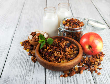 Granola cereal with nuts on a old wooden tableの写真素材