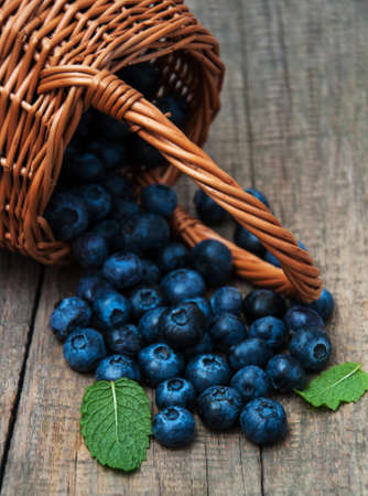 Fresh blueberries on a old wooden tableの写真素材