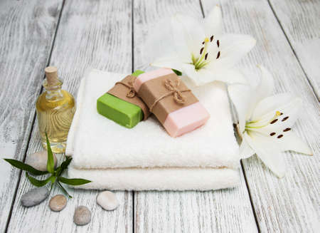 Spa products with white lily on a old wooden backgroundの写真素材