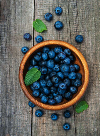 Fresh blueberries on a old wooden table