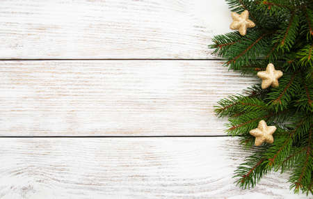 Christmas holiday background - tree  and decoration on a wooden tableの写真素材