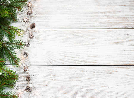 Christmas holiday background - tree  and decoration on a wooden table