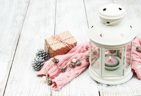 Christmas lantern and decorations on a tableの写真素材