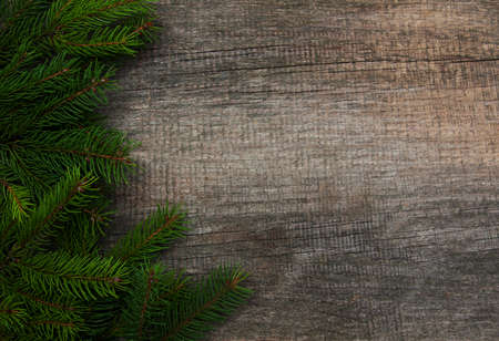 Christmas holiday background - tree  on a wooden tableの写真素材