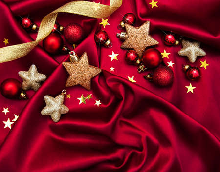 Christmas holiday background -  baubles on a red silkの写真素材