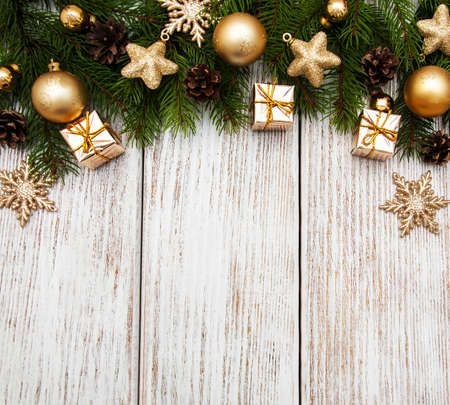 Christmas holiday background - tree  and decoration on a wooden tableの写真素材