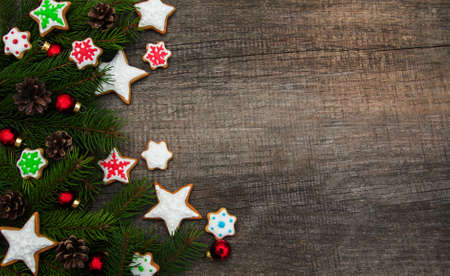 Christmas ginger and honey colorful cookies on a old wooden tableの写真素材