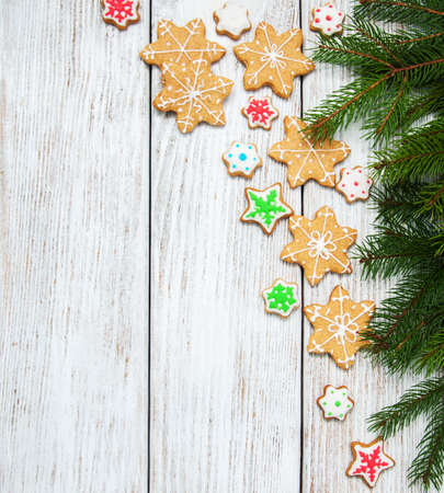 Christmas ginger and honey colorful cookies on a old wooden tableの写真素材