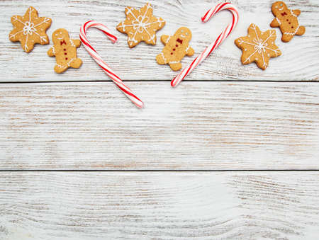 Christmas ginger and honey colorful cookies on a old wooden tableの写真素材