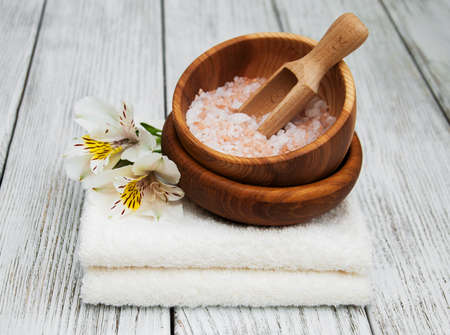 Spa products with alstroemeria flowers on a old wooden tableの写真素材