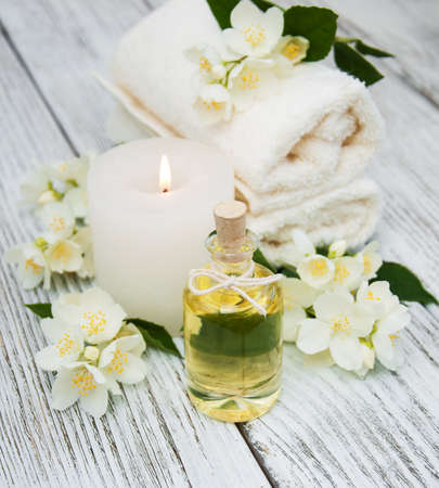 Spa concept with jasmine flowers on a old wooden backgroundの写真素材
