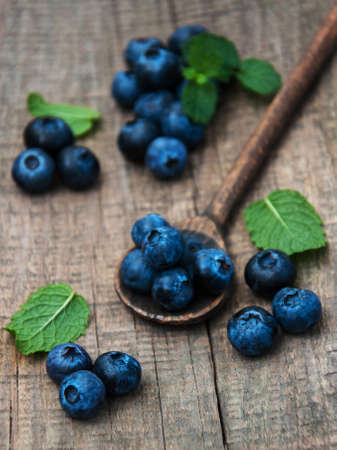 Fresh blueberries on a old wooden tableの写真素材
