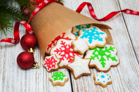 Christmas ginger and honey colorful cookies in a paper packingの写真素材