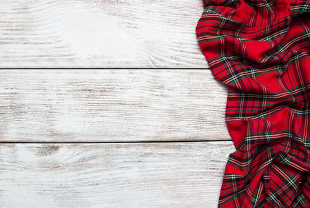 Checkered napkin on a old wooden  backgroundの写真素材