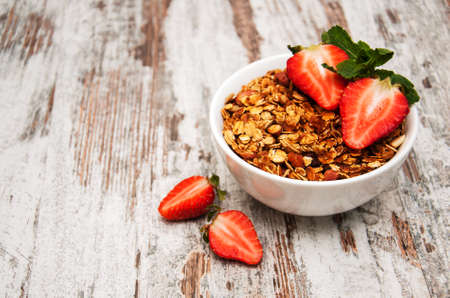 Homemade baked granola on a old  tableの写真素材