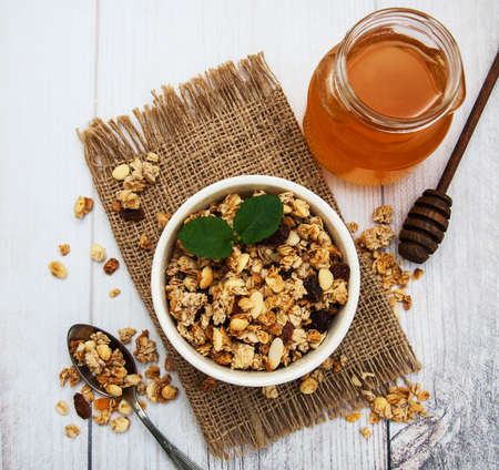 Bowl with granola  on a old wooden tableの写真素材