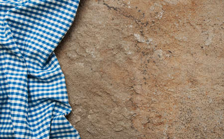 Checkered napkin on a brown stone backgroundの写真素材