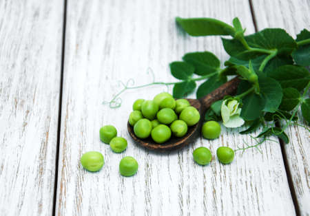 green peas  on rustic white wooden backgroundの写真素材