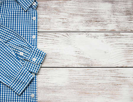 Checkered shirt on a old wooden backgroundの写真素材