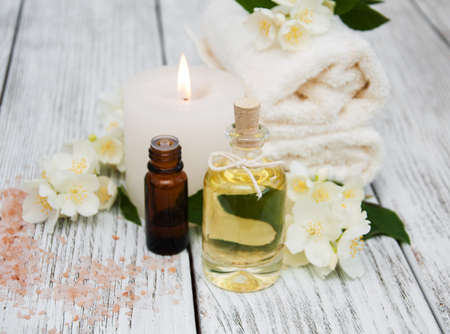 Spa concept with jasmine flowers on a old wooden backgroundの写真素材