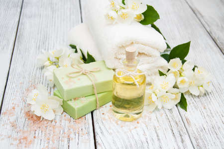 Spa concept with jasmine flowers on a old wooden backgroundの写真素材