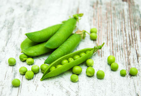 green peas  on rustic white wooden backgroundの写真素材