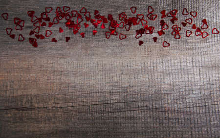Red hearts on a old wooden backgroundの写真素材