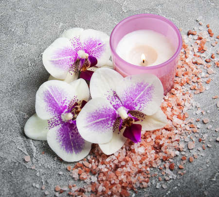 Spa products with orchids on a old gray stone backgroundの写真素材